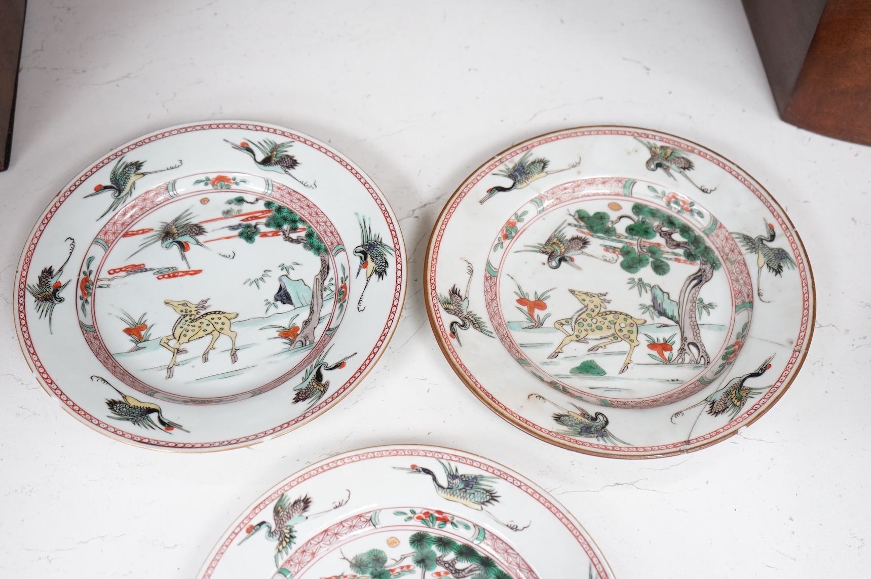 Three Chinese famille verte deer and crane plates, Kangxi period, 22cm in diameter